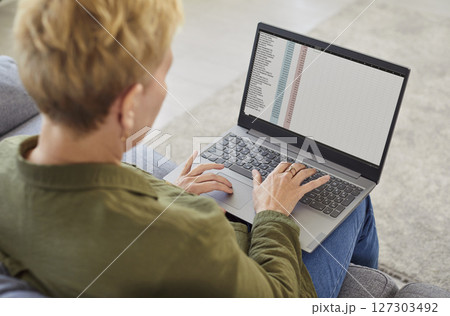 Senior Woman Working Online With A Laptop At Home 127303492