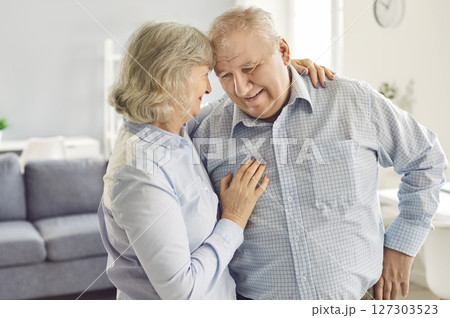 Happy Elderly Family Couple Embracing At Home Happy Elderly Family Couple Embracing At Home 127303523