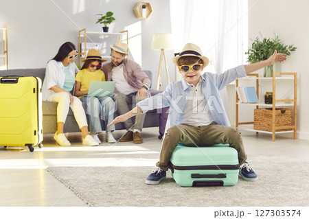 Happy Boy Showing Flight During Preparing For Summer Vacation Or Trip Happy Boy Showing Flight During Preparing For Summer Vacation Or Trip 127303574