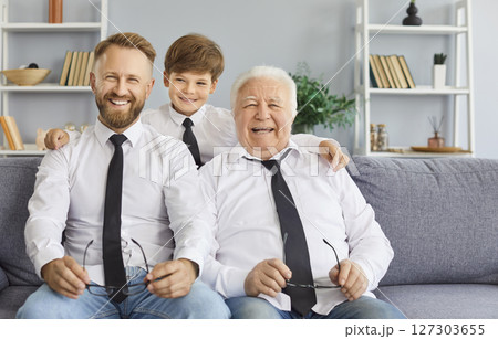 Happy family of three generation men portrait grandfather, father, son, cute child grandson at home Happy family of three generation men portrait grandfather, father, son, cute child grandson at home 127303655