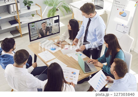 Business team having a video call with their manager during a meeting in the office Business team having a video call with their manager during a meeting in the office 127303840