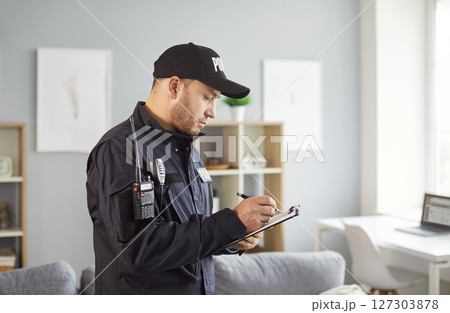 Policeman writing crime data report, statistic, interrogating victim or witnessed, officer police Policeman writing crime data report, statistic, interrogating victim or witnessed, officer police 127303878