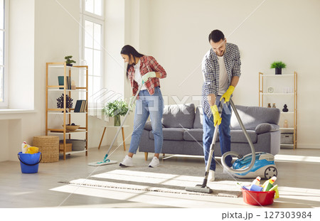 Young Couple Embraces Happiness in Cleaning Together 127303984