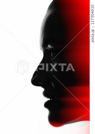 Part beautiful woman face silhouette covered in shadow in RGB color channel split effect style Part beautiful woman face silhouette covered in shadow in RGB color channel split effect style 127304010