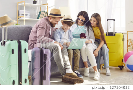 Family Planning Vacation Using Laptop At Home 127304032