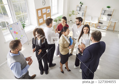 Business People Hosting A Meeting Or Presentation In Office Business People Hosting A Meeting Or Presentation In Office 127304055