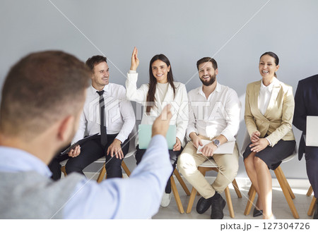 Diverse business team applicants, businesspeople sitting in row, queue waiting for job interview Diverse business team applicants, businesspeople sitting in row, queue waiting for job interview 127304726