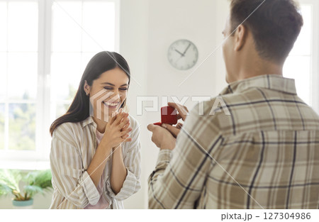 Man Proposing To Woman With A Ring At Home 127304986