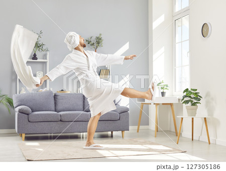 Happy Man Dancing In Bathrobe To Music During Morning Routine Happy Man Dancing In Bathrobe To Music During Morning Routine 127305186