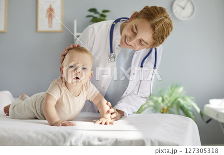 Pediatrician Examines Young Child Patient In Hospital Setting Pediatrician Examines Young Child Patient In Hospital Setting 127305318