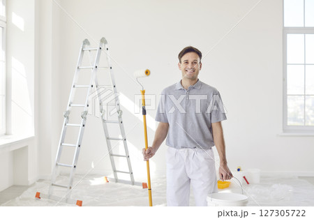 Smiling Painter At Work During Home Renovation 127305722