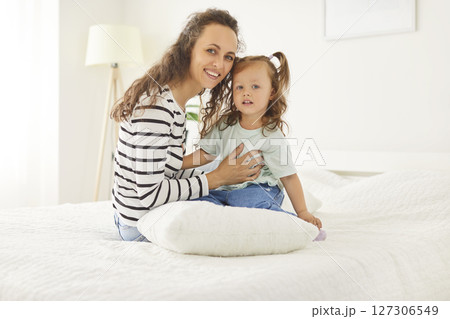 Happy smiling mother and baby daughter, babysitter nanny, friendly loving family at home close enjoy Happy smiling mother and baby daughter, babysitter nanny, friendly loving family at home close enjoy 127306549