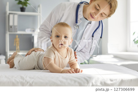 Portrait Of Little Baby With Pediatrician At Clinic Health Checkup Portrait Of Little Baby With Pediatrician At Clinic Health Checkup 127306699