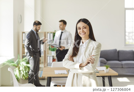 Portrait Of Successful Businesswoman With Colleagues In Office 127306804
