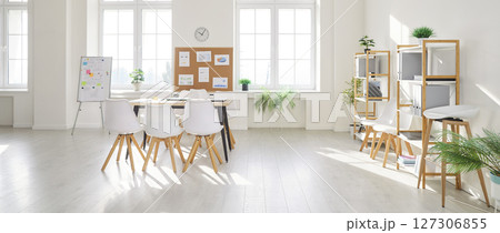 Modern bright and spacious office interior with organized open space and empty conference room. Modern bright and spacious office interior with organized open space and empty conference room. 127306855