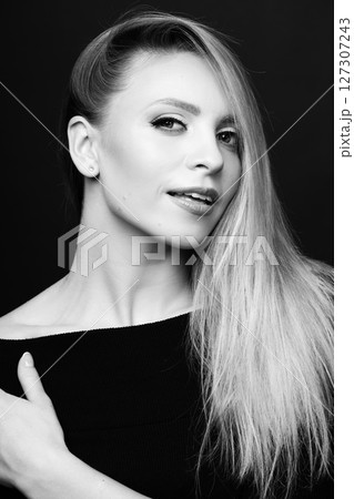 Beautiful blonde woman with black dress and classic make-up studio portrait Beautiful blonde woman with black dress and classic make-up studio portrait 127307243