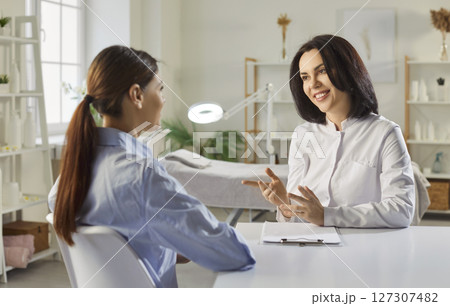 Professional cosmetologist consulting on skin investigation, spa beautician facial examine study 127307482