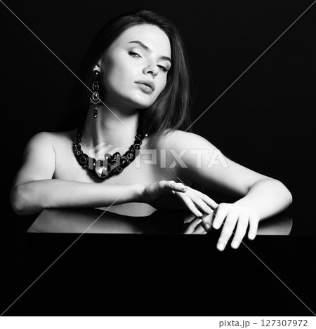 Beautiful woman with fancy necklace and earrings studio portrait Beautiful woman with fancy necklace and earrings studio portrait 127307972