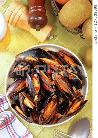 Mussels in cream cheese sauce and garlic.  127308099