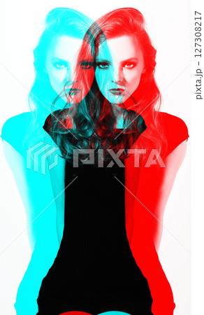 Beautiful woman studio portrait in RGB color effect split 127308217