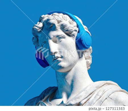 White greek sculpture wearing blue headphones on blue background 127311383