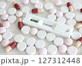 Positive test result of Covid-19 antigen test kit and drugs isolated on the white background 127312448