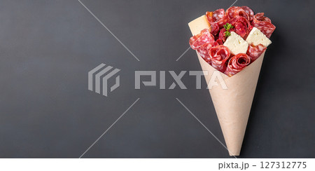 stunning charcuterie cone filled with cured meats and cheese, perfect for gatherings 127312775