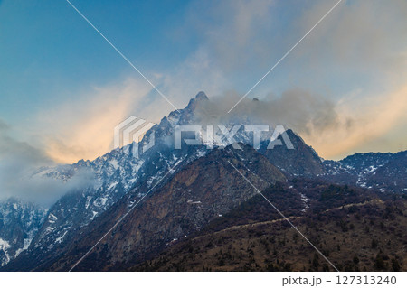 Majestic snow-covered mountains during sunset 127313240