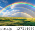 青空の虹と草原 127314949