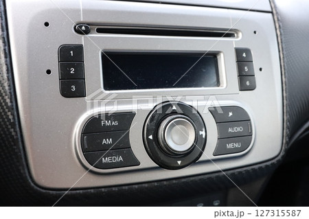 The modern car audio control panel showcases an impressive array of features and technology 127315587