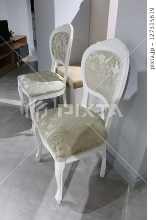 Experience the elegance of vintage chairs featuring intricate and exquisite upholstery design 127315619