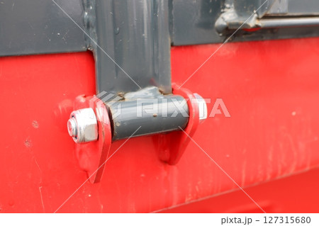 Detailed CloseUp of Industrial Container Hinge Mechanism for Enhanced Functionality and Design Detailed CloseUp of Industrial Container Hinge Mechanism for Enhanced Functionality and Design 127315680