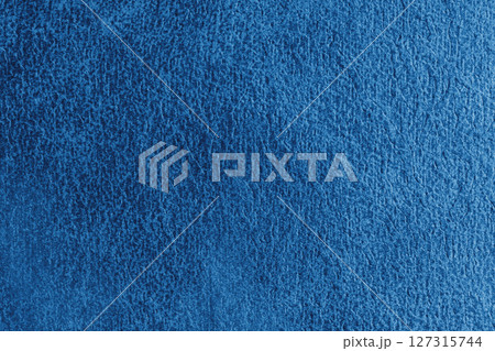 Close up, macro structure of blue suede fabric with abstract embossed shabby, messy texture. 127315744
