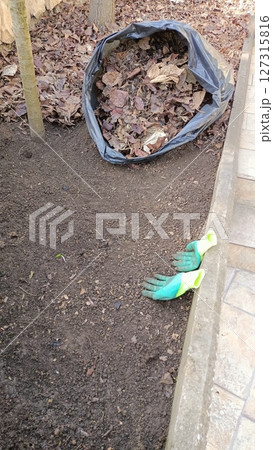 Garden CleanUp Preparing Soil and Clearing Leaves for an enjoyable and productive space 127315816