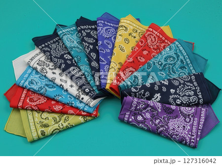 Vibrant Multicolor Paisley Bandana Collection Arranged in Fan Shape on Turquoise Background, Classic Cotton Kerchiefs in Assorted Colors for Fashion, Crafts, and Western Decor 127316042