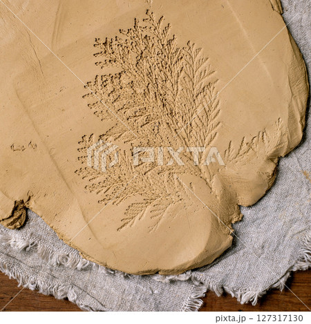 Decorating of raw clay ceramics 127317130