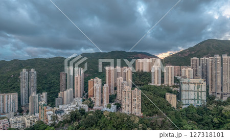 June 10 2025 Residential Skyscrapers Against a Green Mountain Backdrop at Sunset June 10 2025 Residential Skyscrapers Against a Green Mountain Backdrop at Sunset 127318101