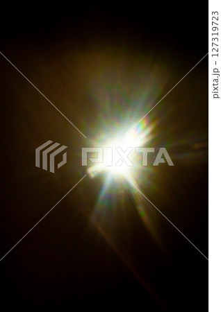 Sun flare on the black background Sun flare on the black background 127319723
