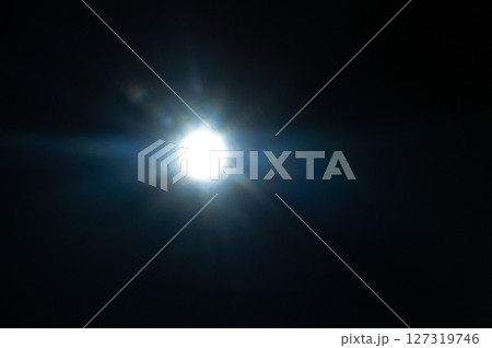 Sun flare on the black background Sun flare on the black background 127319746