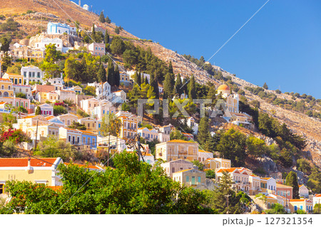 Colorful hillside houses in Symi, Greece Colorful hillside houses in Symi, Greece 127321354