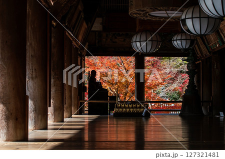 Silhouette Buddha statue in Hasedera temple hall at fall, Nara 127321481