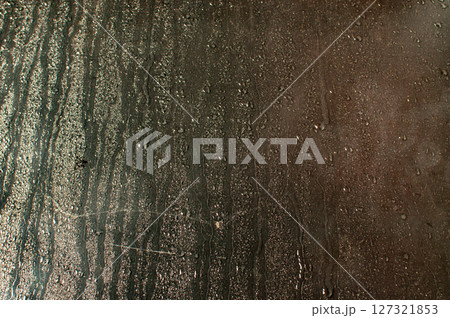 Water drops on glass window Water drops on glass window 127321853
