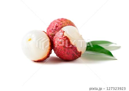Three Juicy Lychee with cut in half and leaves isolated on white background. 127323923
