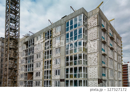 Monolithic frame construction of the building. Family mortgage. Shooting from a drone. Modern construction of a residential building. construction site close up. Multi-storey building. . 127327172