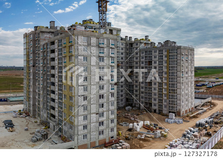 Monolithic frame construction of the building. Family mortgage. Shooting from a drone. Modern construction of a residential building. construction site close up. Multi-storey building. . Monolithic frame construction of the building. Family mortgage. Shooting from a drone. Modern construction of a residential building. construction site close up. Multi-storey building. . 127327178