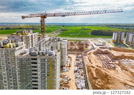 Monolithic frame construction of the building. Family mortgage. Shooting from a drone. Modern construction of a residential building. construction site close up. Multi-storey building. . 127327182