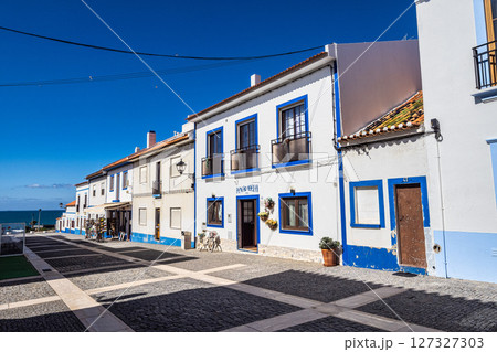Porto Covo, Portugal - Feb 28, 2025: Traditional blue and white Alentejo Portuguese buildings in Porto Covo, Portugal 127327303