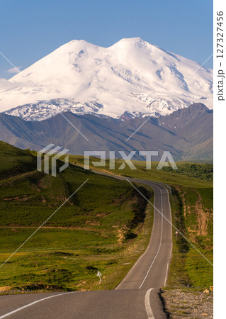 Elbrus Road Trip, Caucasus: Mountain peak road in summer for scenic driving. Elbrus Road Trip, Caucasus: Mountain peak road in summer for scenic driving. 127327456
