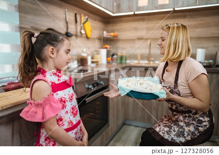 Cooking together brings joy in a cozy kitchen on a sunny afternoon 127328056