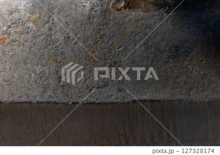 Rusty metal texture for background. Macro shot of stainless steel knife opening with rust Rusty metal texture for background. Macro shot of stainless steel knife opening with rust 127328174